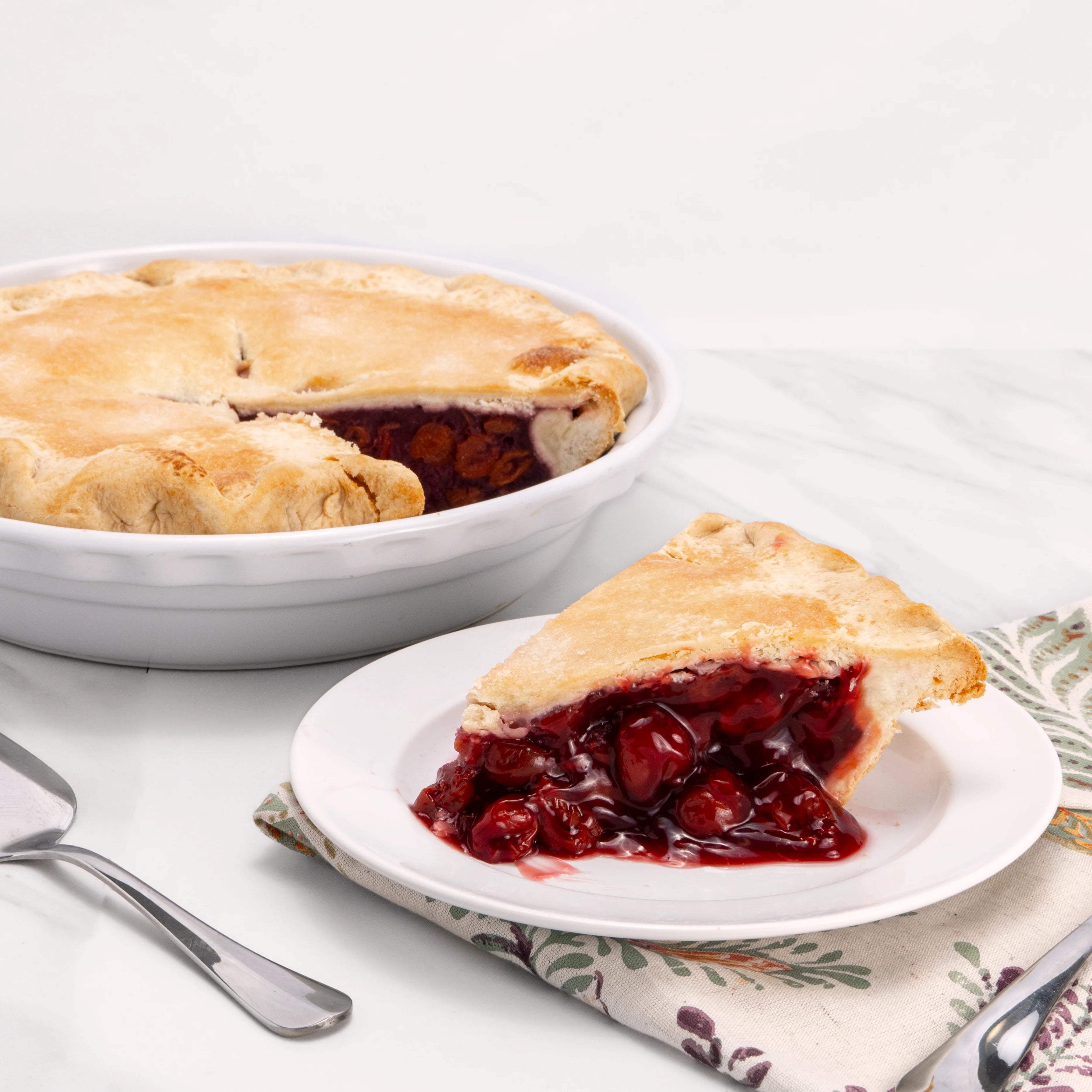 Slice of Cherry Pie in front of an 11" pie from which it was cut.