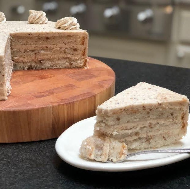 Three layer brown butter pecan cake with buttercream icing.